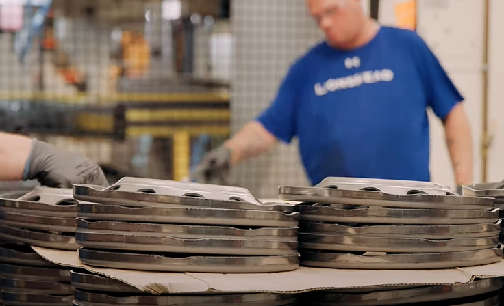 Wheel discs are stacked after being stamped.